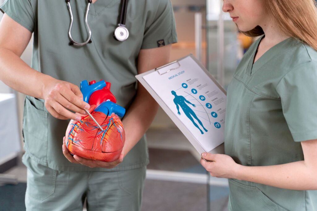 Young medicine student doing cardio practice in a hospital