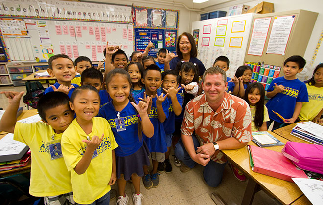 schoolchildren and adults in class