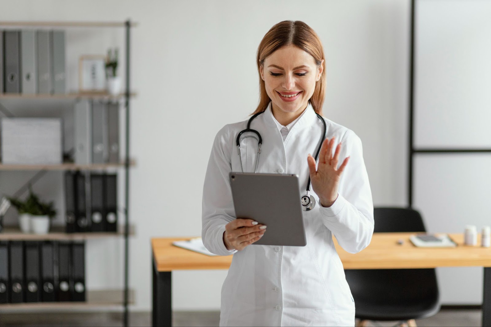 Doctor holding and using tablet