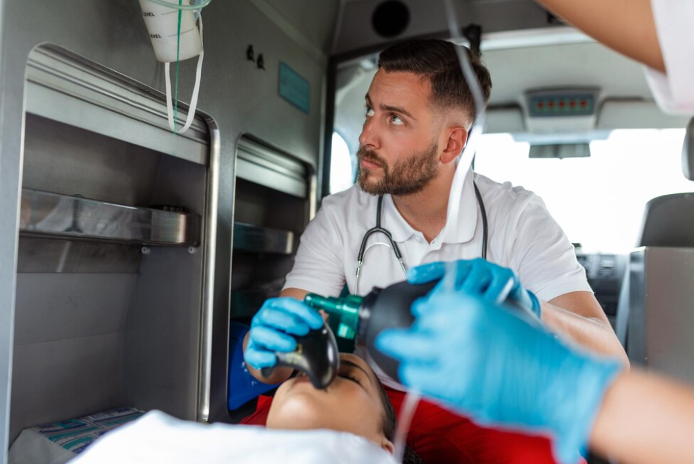 A medic in an ambulance attending to a patient