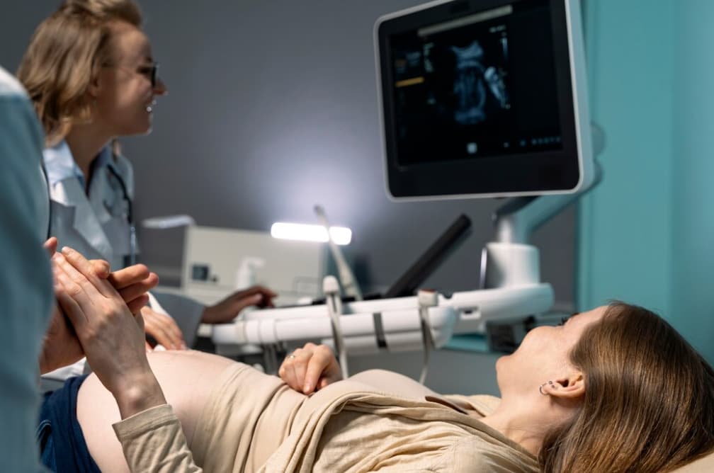A pregnant woman undergoing an ultrasound scan
