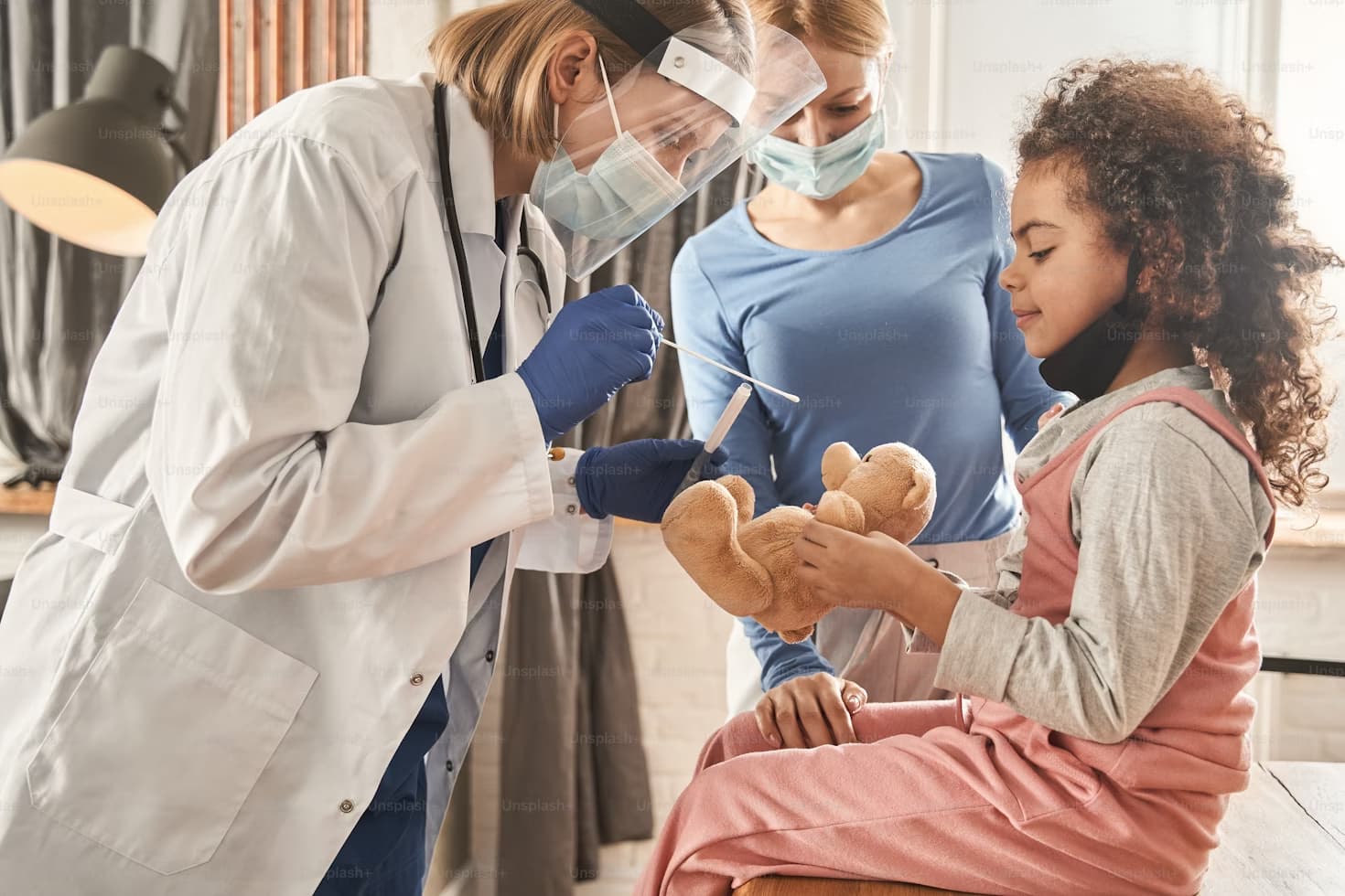 Mother and Daughter at a Check-up with a Doctor